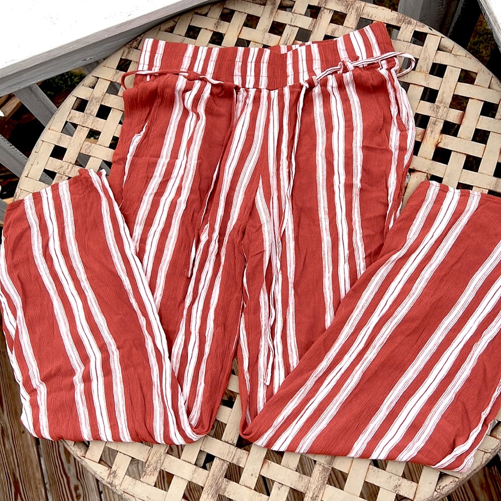 Flowey orange and white striped pants. Medium size but fit like a small.